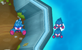 An Ice Monkey (top) and a Mermonkey (bottom) being transformed on top of the water on Flooded Valley.