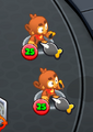 Two Dart Monkey Twins' near each other